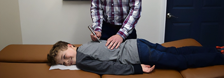 Chiropractor Delafield WI Alexander Young Adjusting Boy