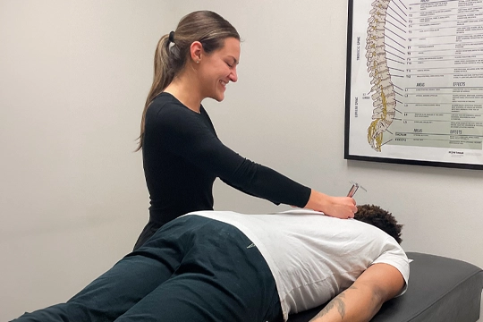 Chiropractor Delafield WI Marlee Williams Adjusting Patient